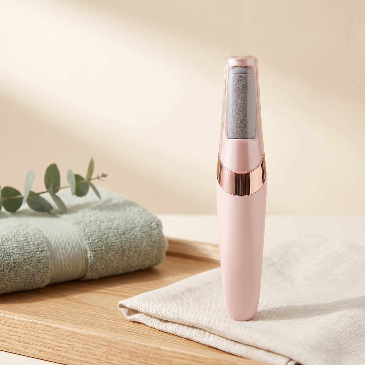 Serenus SoftStep electric callus remover in blush pink with rose-gold band