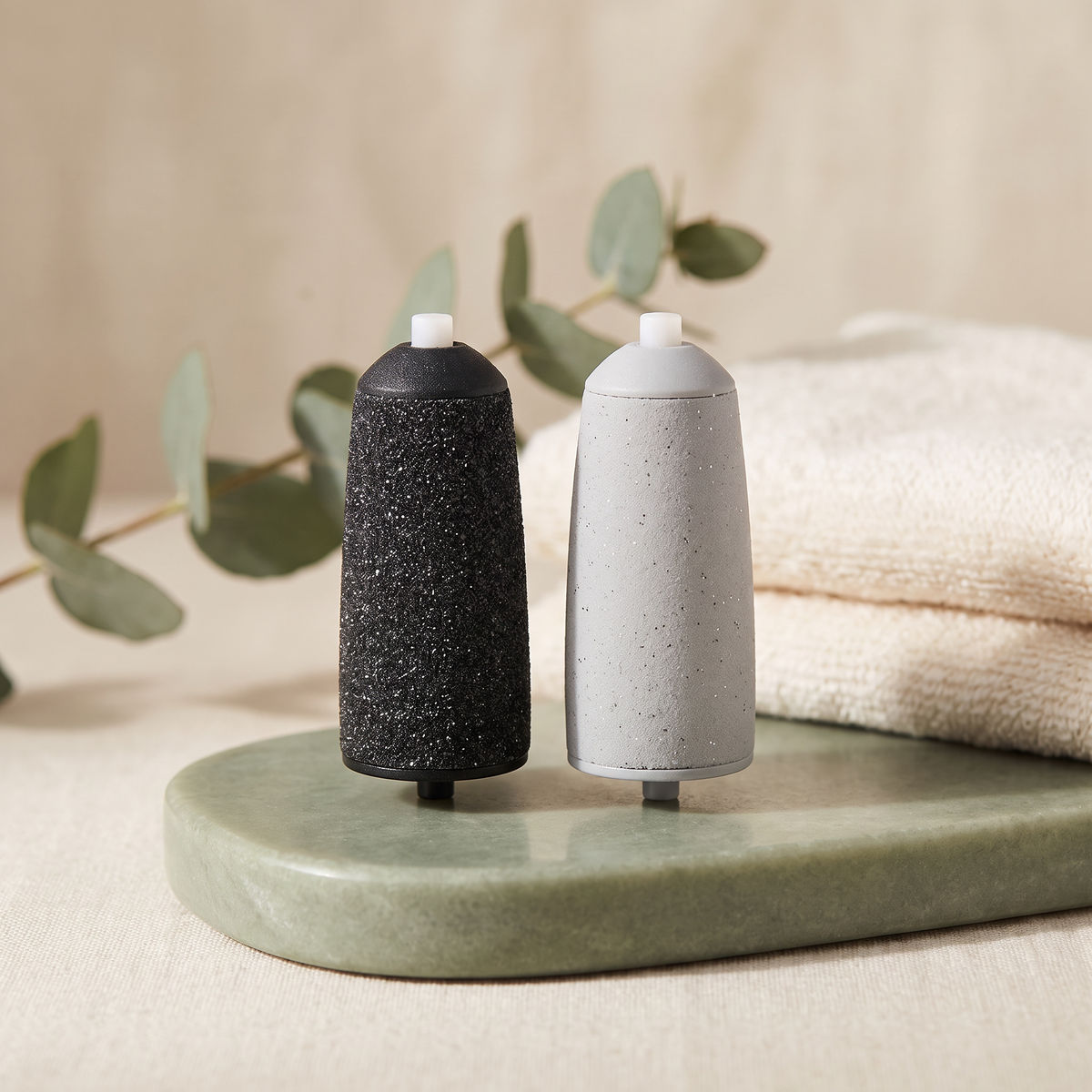 Serenus SoftStep fine and coarse replacement roller heads on a sage plinth