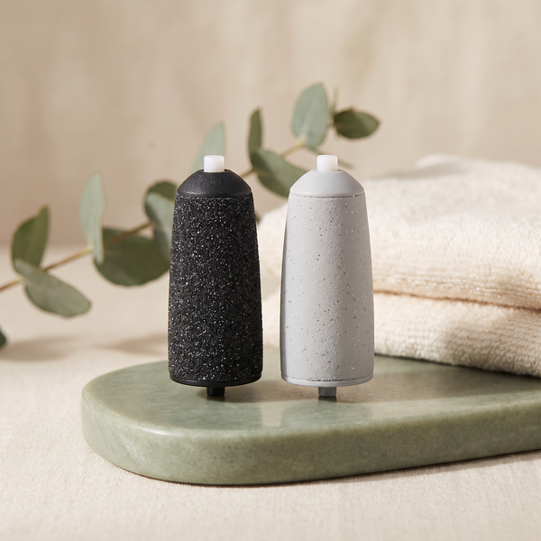 Serenus SoftStep fine and coarse replacement roller heads on a sage plinth